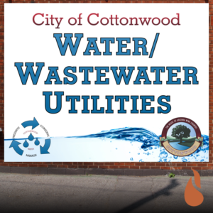Cottonwood Water Utilities square banner on brick wall