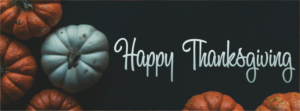 happy thanksgiving pumpkins flat lay black header
